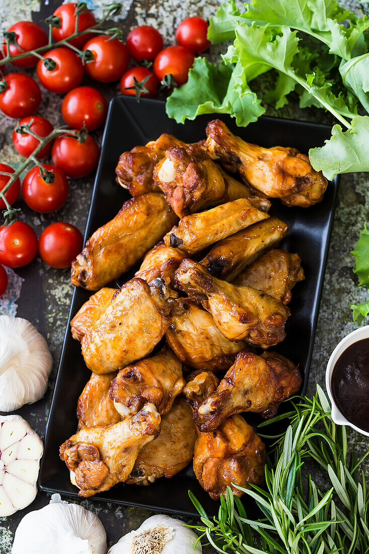 Roasted chicken wings and chicken drumsticks