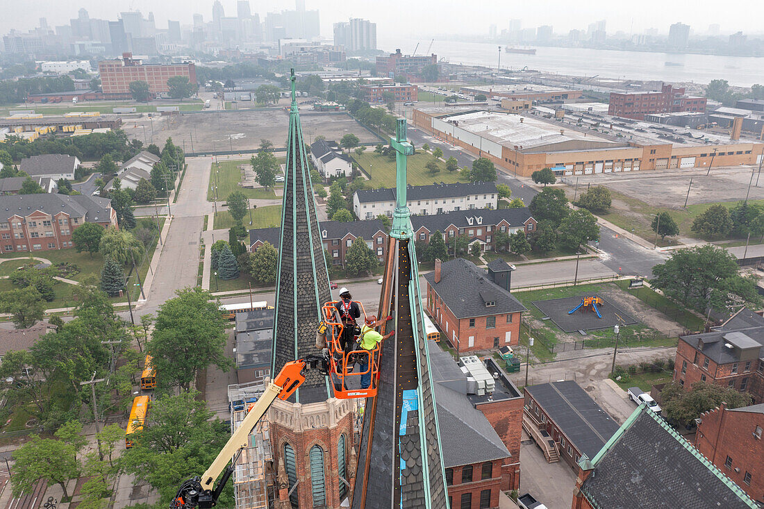 Workers repairing the Basilica of Sainte Anne de Detroit