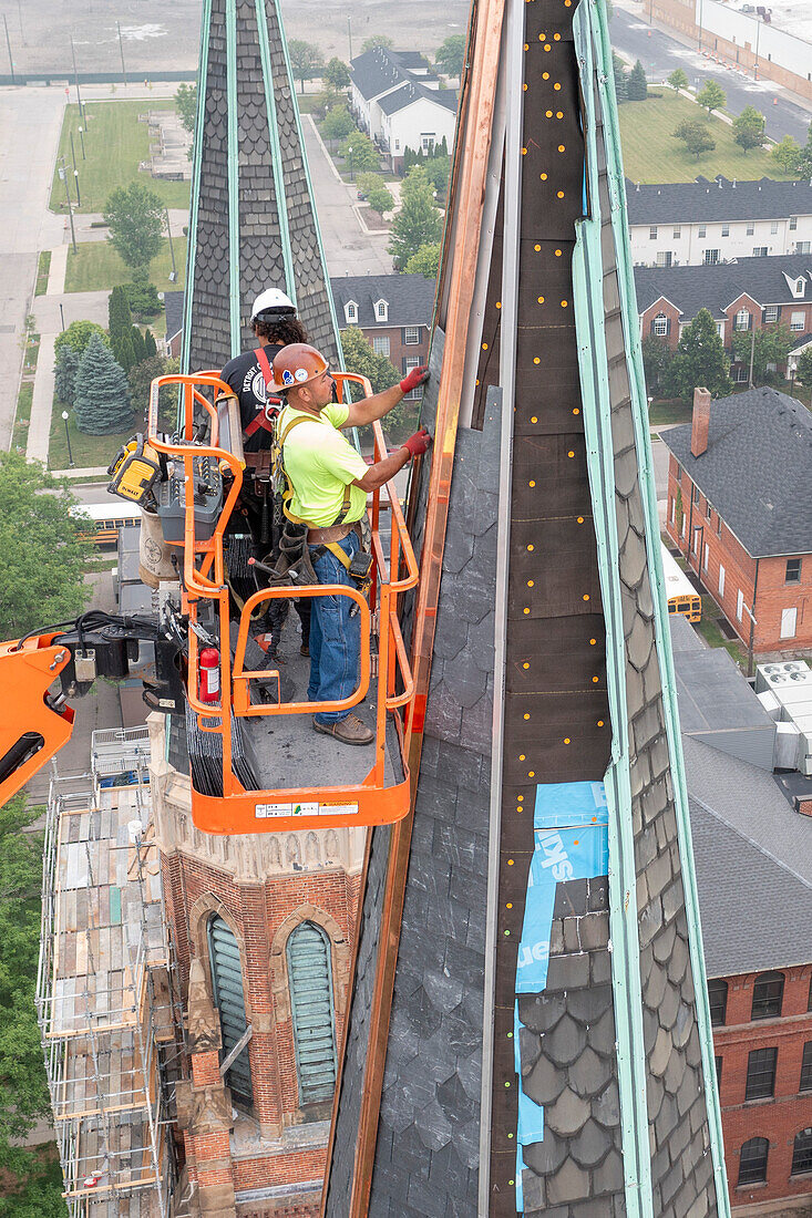 Workers repairing the Basilica of Sainte Anne de Detroit