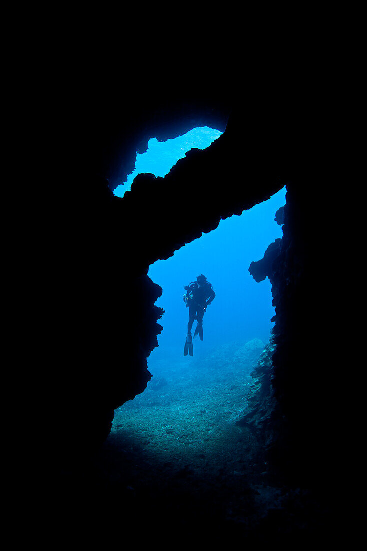 Diver at cave entrance