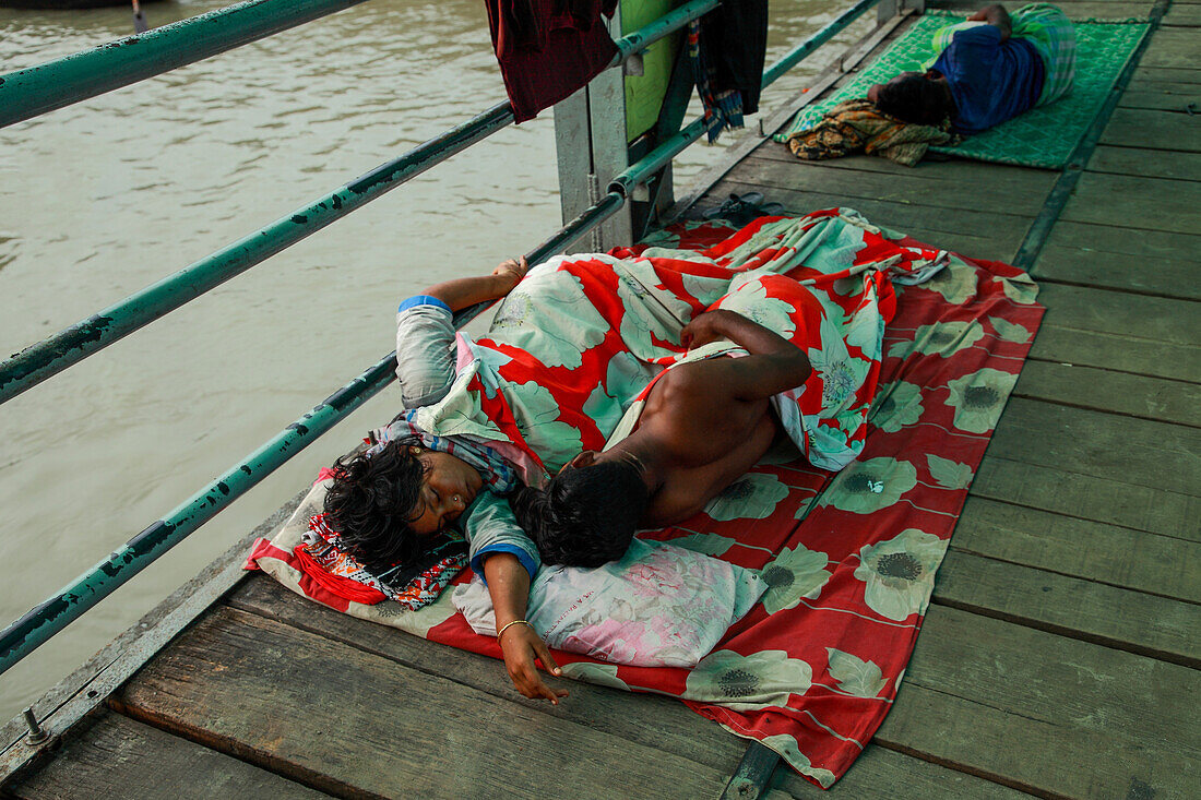 Homeless people sleeping on bridge, Dhaka, Bangladesh
