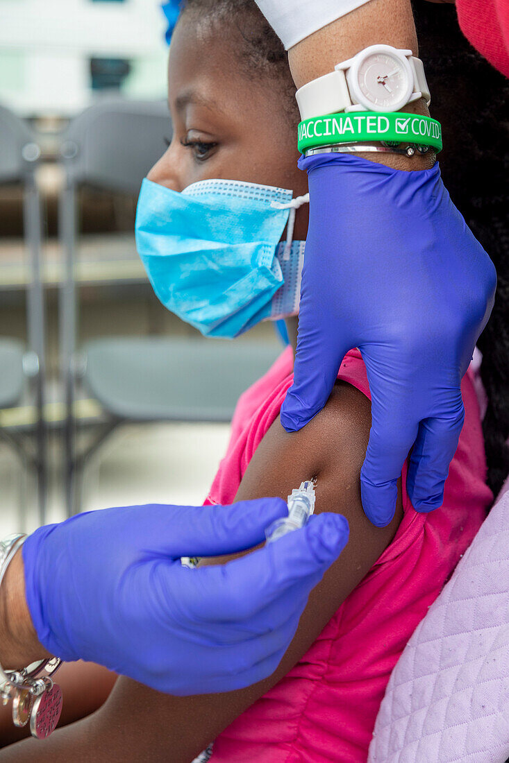 Girl receiving flu shot