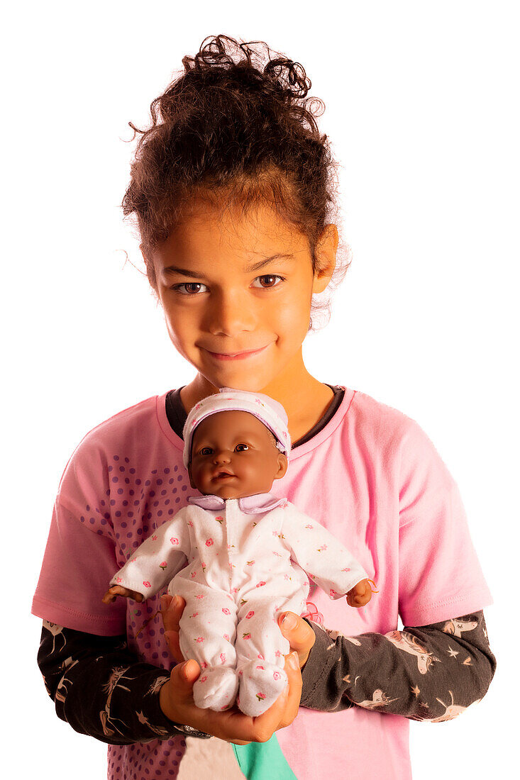 Girl holding doll
