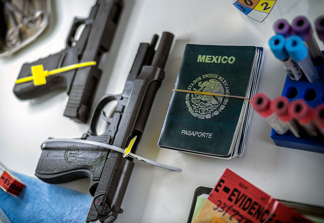 Handguns and passports in forensics lab