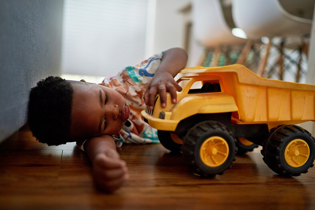 Boy playing with dump truck toy