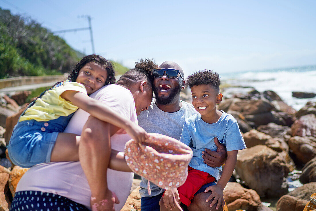 Family on seaside rocks