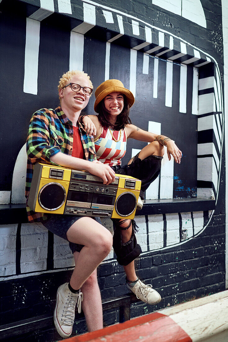Young couple with boom box