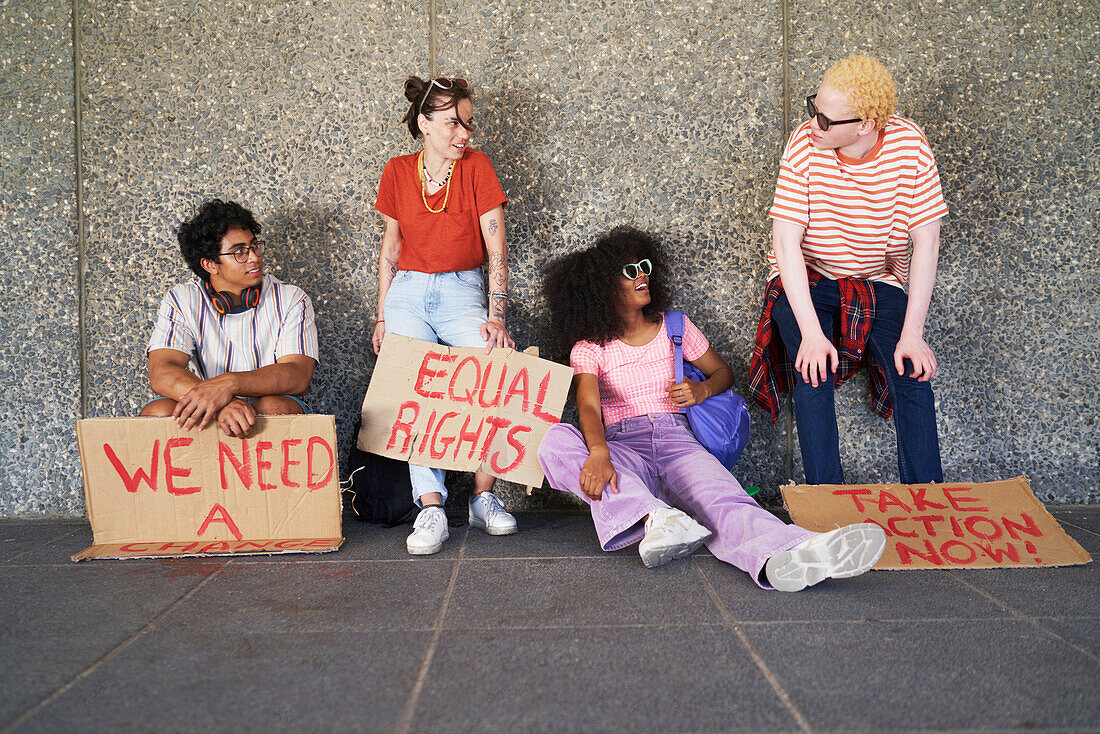 Young friends with equal rights signs