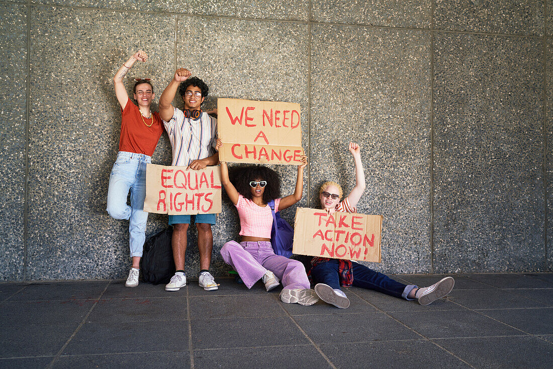 Young protester friends holding equal rights signs
