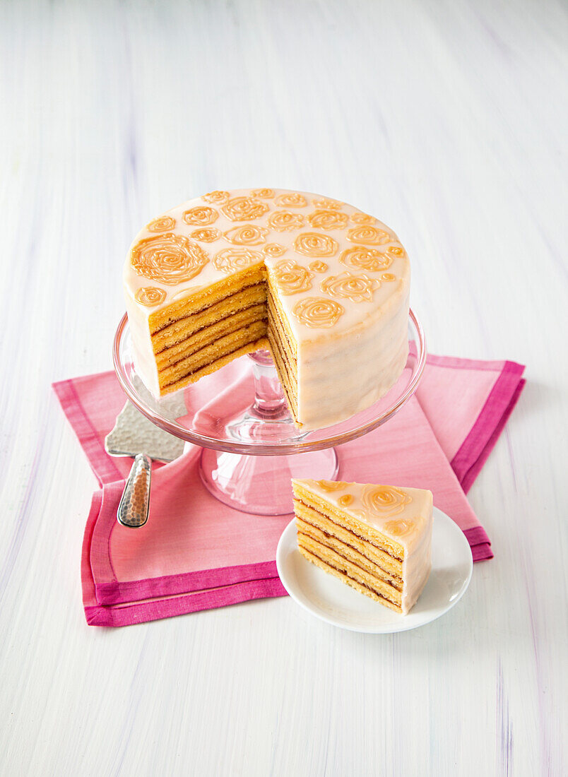 Striped cake with orange roses