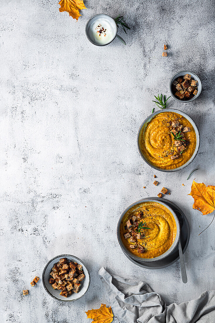 Creamy chickpea and carrot soup with rosemary and croutons