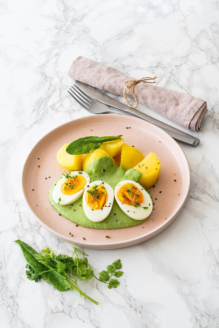 Boiled eggs with Frankfurt green sauce and boiled potatoes