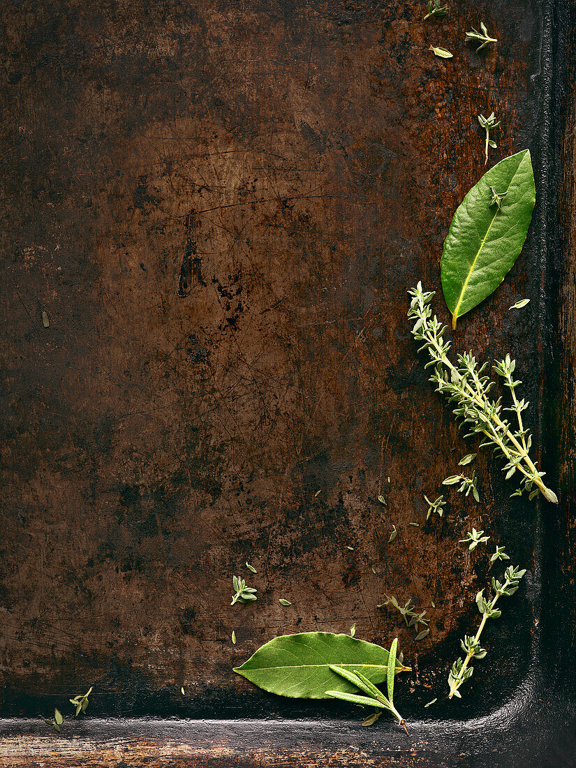 Old baking tray with herbs