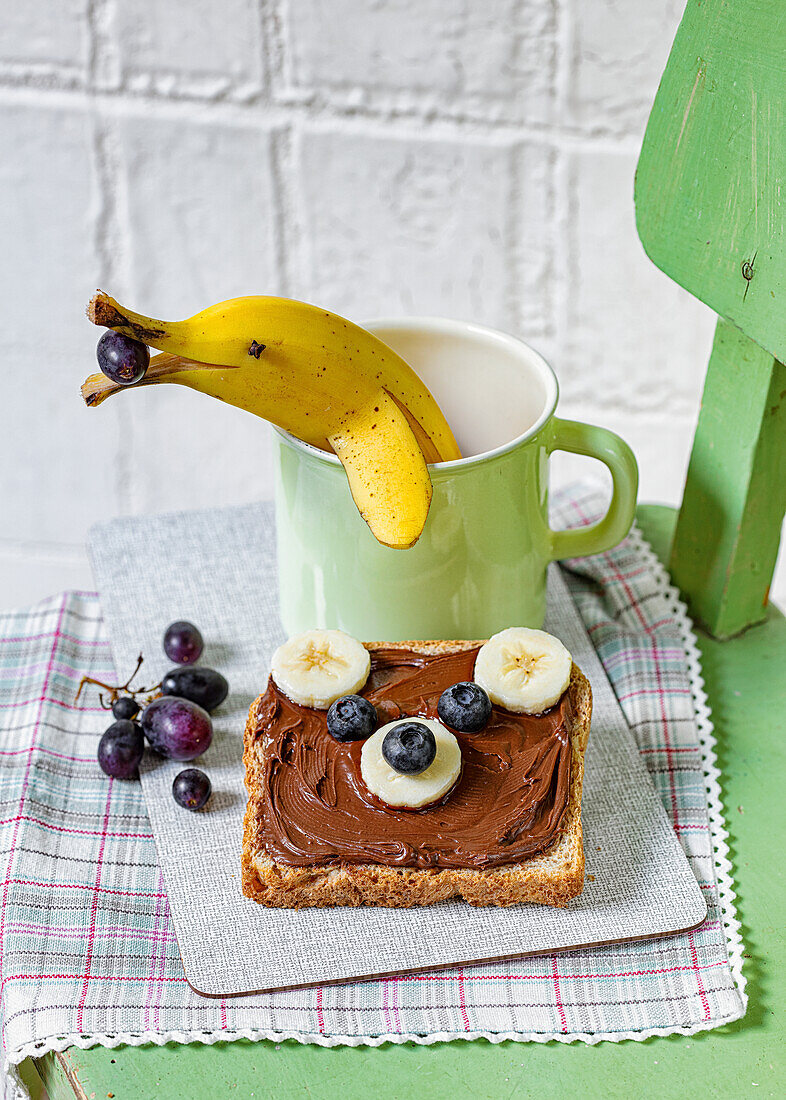 Teddy bear toast with nut butter, banana dolphin