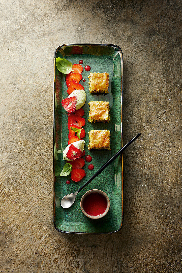 Lime and basil mousse with strawberry carpaccio and baklava