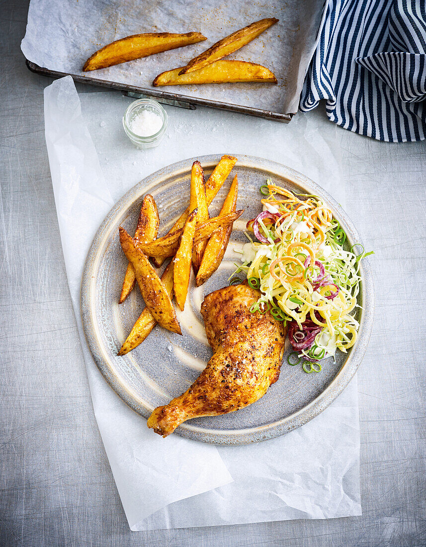 Baked chicken with chips and coleslaw