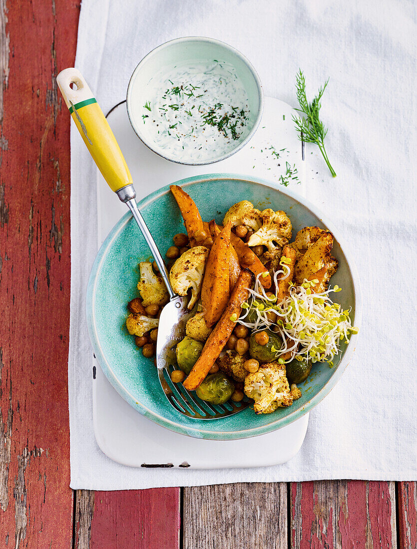 Baked vegetables from the tray with yoghurt dip