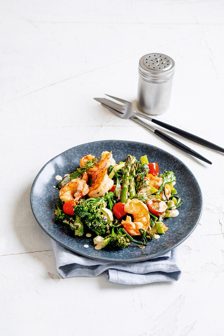 Vegetable and wild garlic pan with prawns