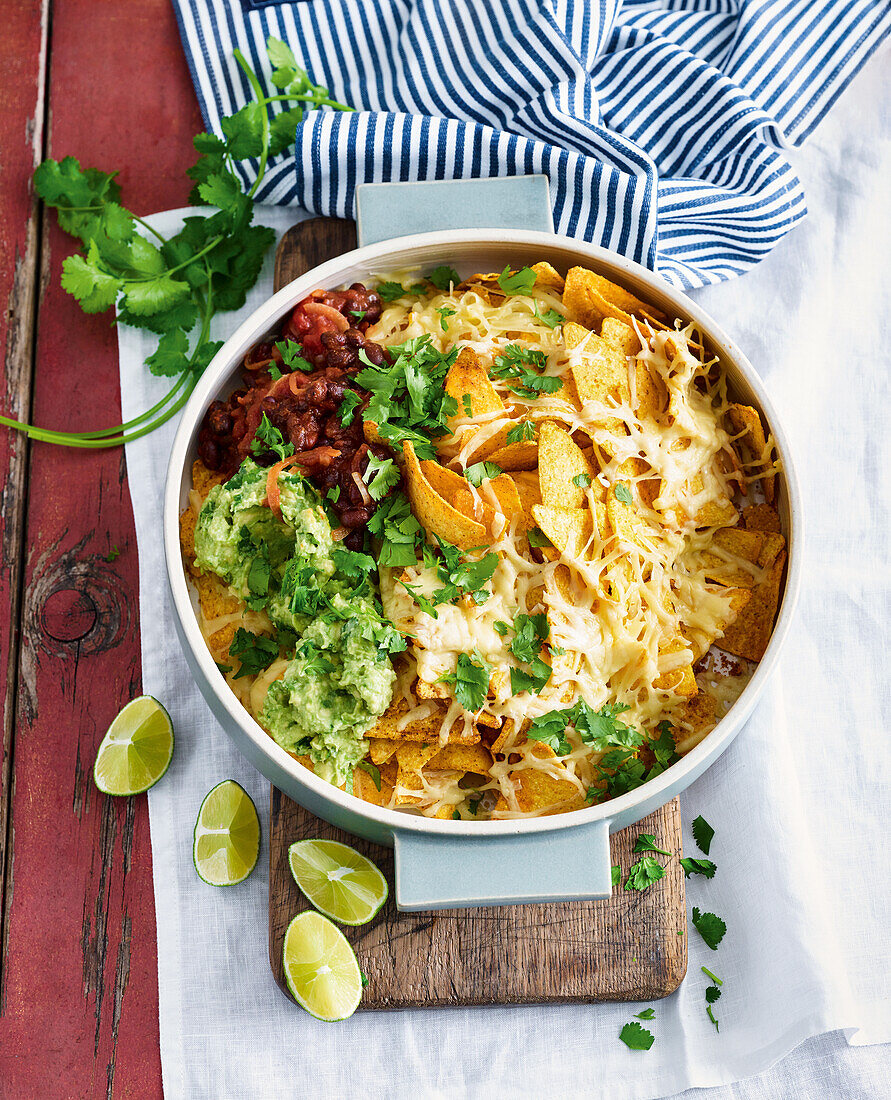 Nachos with guacamole, black beans and cheese