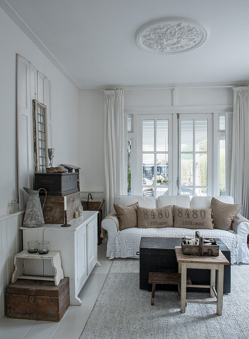 Country-style living room with rustic wooden furniture and brown and white accents