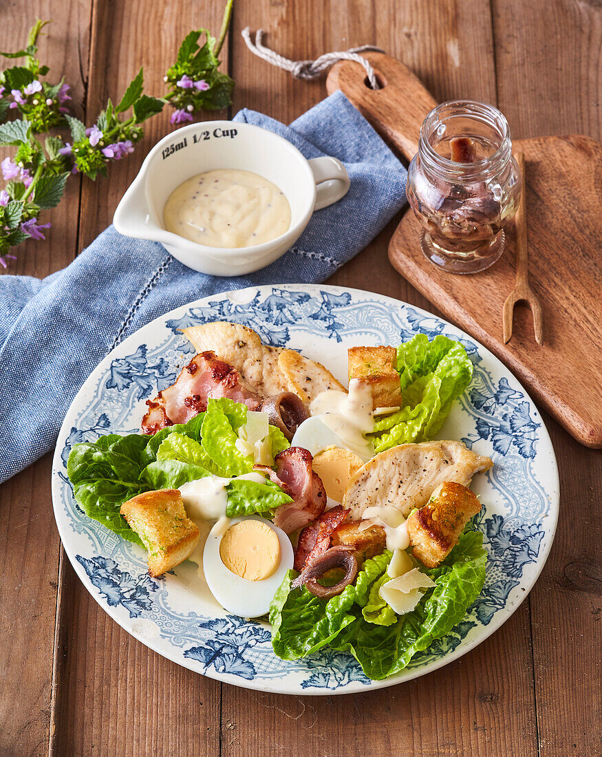 Caesar salad with hard-boiled eggs and bacon