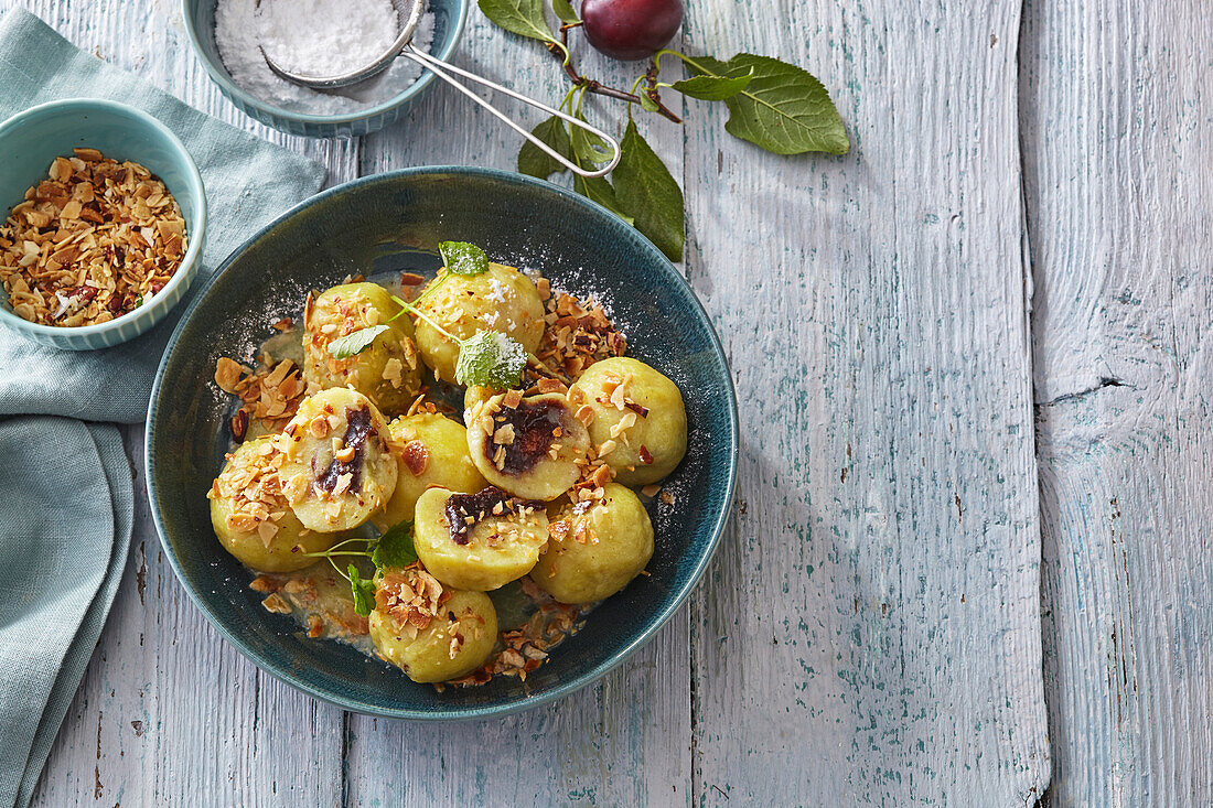 Sweet potato dumplings filled with plum jam and crumble