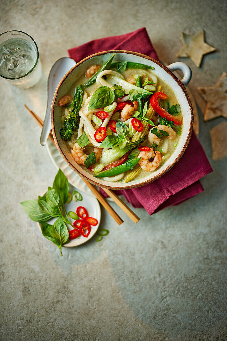 Thai curry noodle soup with prawns and vegetables
