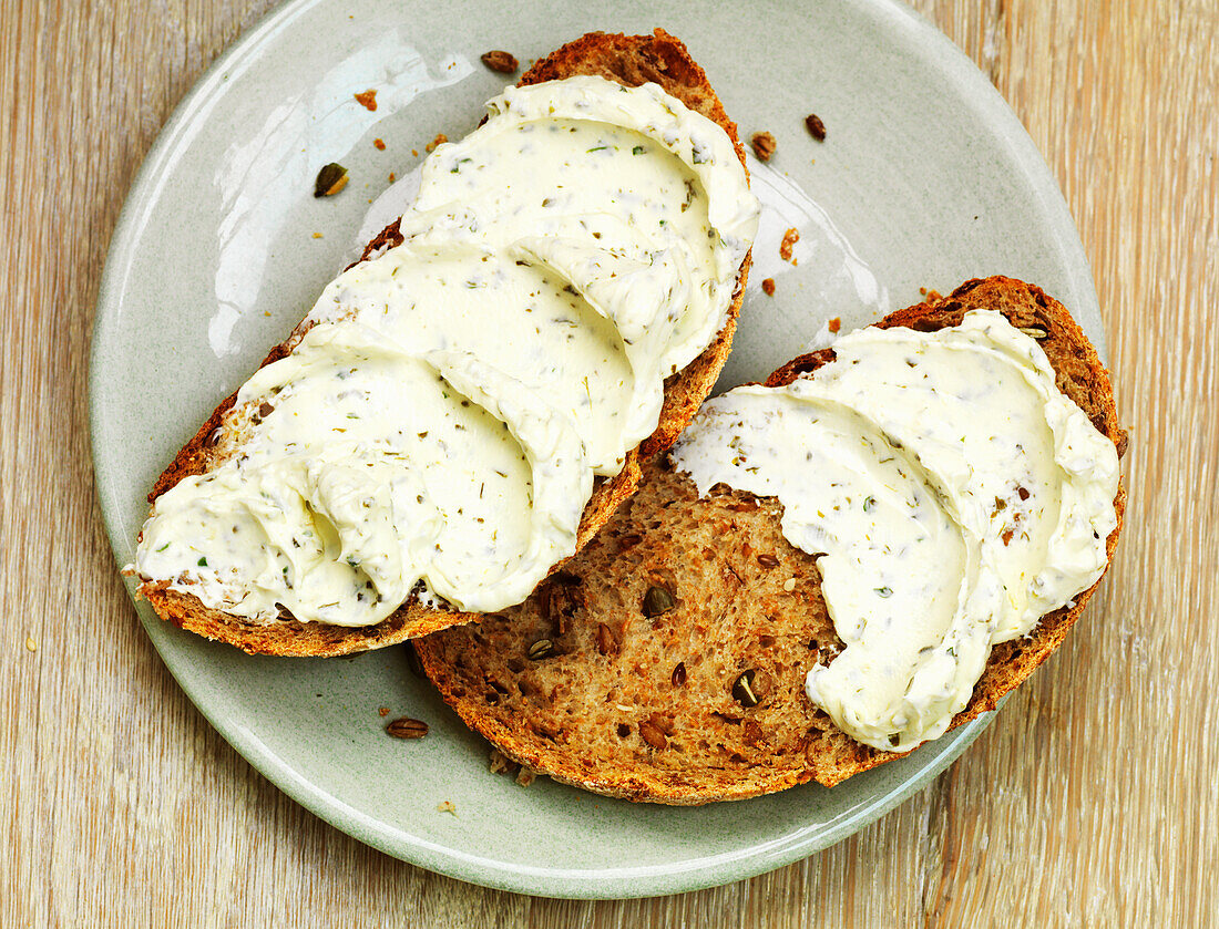 Cream cheese with herbs on toasted bread