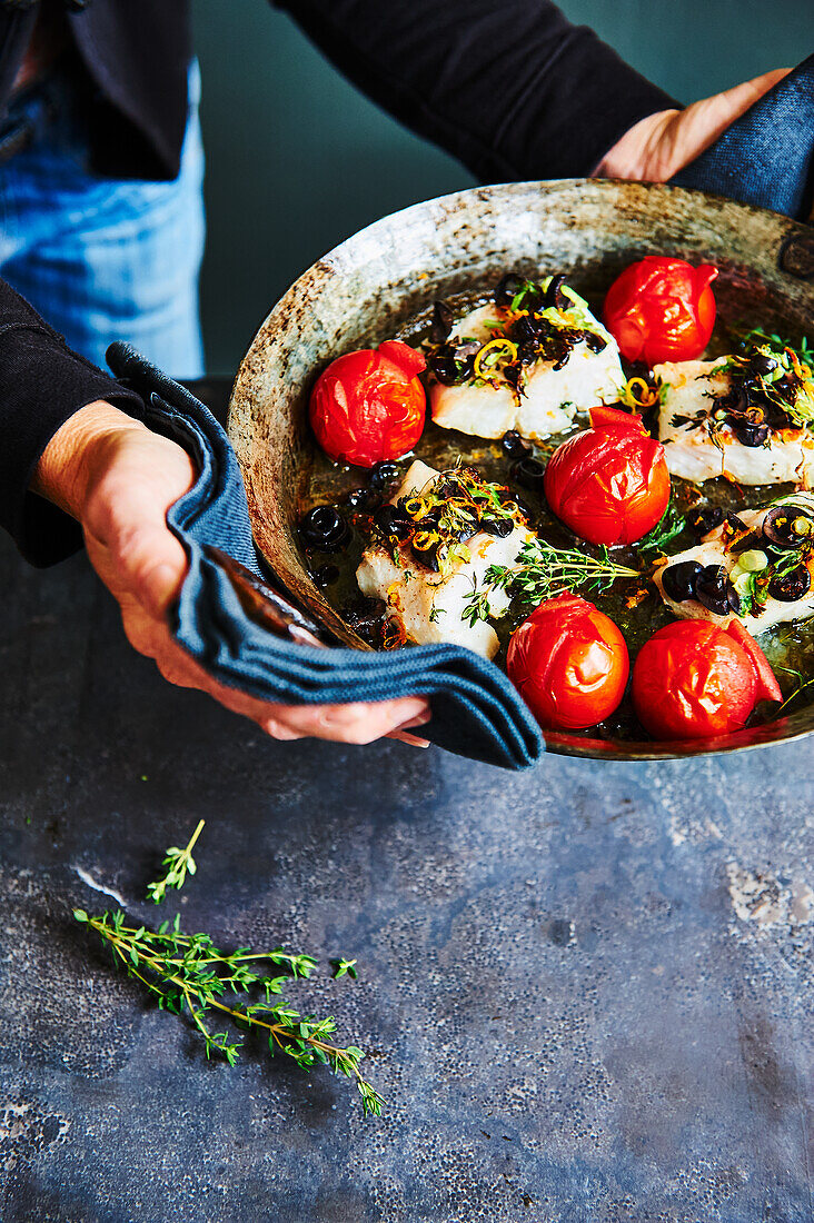 Cod pan with tomatoes and herbs from the oven