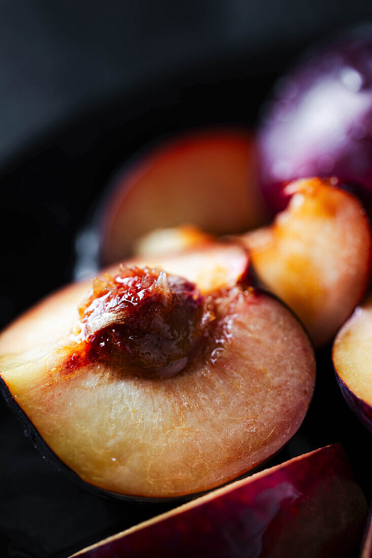 Sliced plum with stone, close up