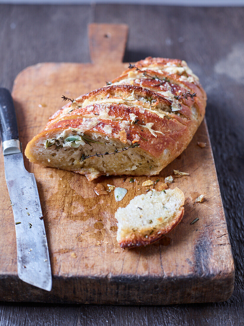 Parmesan bread with herbs, sliced