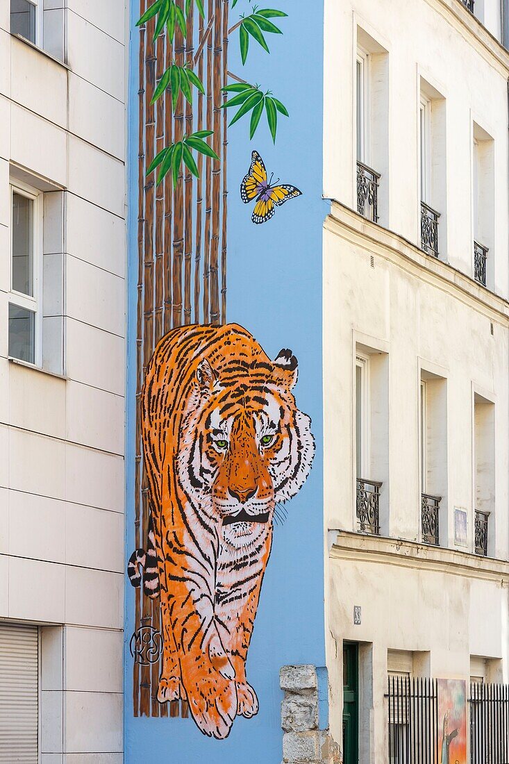 France,Paris,street art,fresco painted by Mosko named Tigre Papillons et Bambous on the facade of an apartment building in Rue du Retrait
