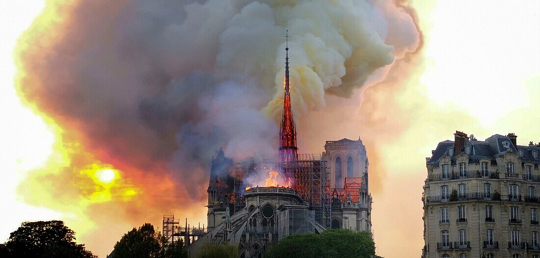 [ Unpublished - Exclusive ] France,Paris,area listed as World Heritage by UNESCO,Notre Dame Cathedral of 14th century Gothic architecture during the fire of 15th April 2019,the arrow flares up 20 minutes after the beginning of the fire