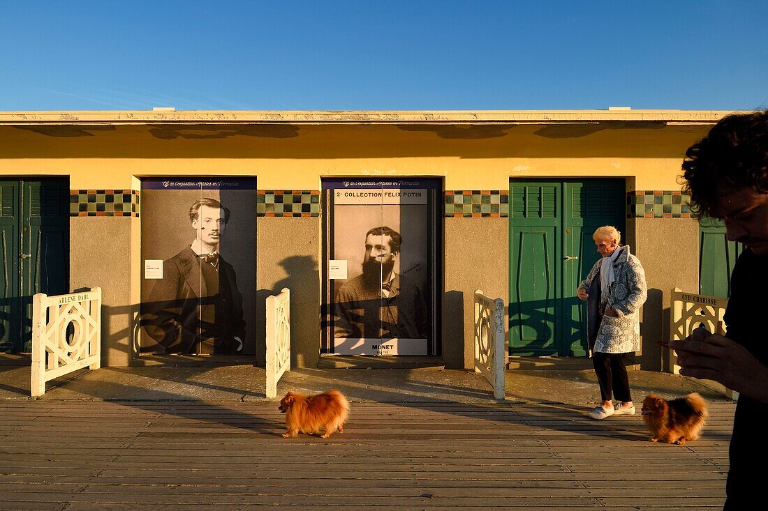 France,Calvados,Pays d'Auge,Deauville,the famous planks on the beach,lined with Art Deco style bathing cabins,tribute to Monet and Renoir