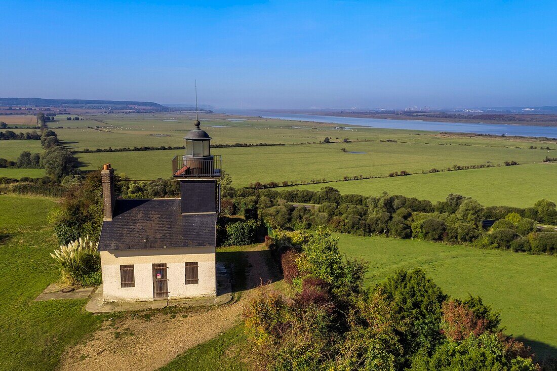 France,Eure,Marais Vernier region,Natural Reserve of the Seine estuary,Saint Samson de la Roque,Roque lighthouse on Pointe de la Roque overlooks the Seine river estuary,the Normandy bridge far in the background (aerial view)