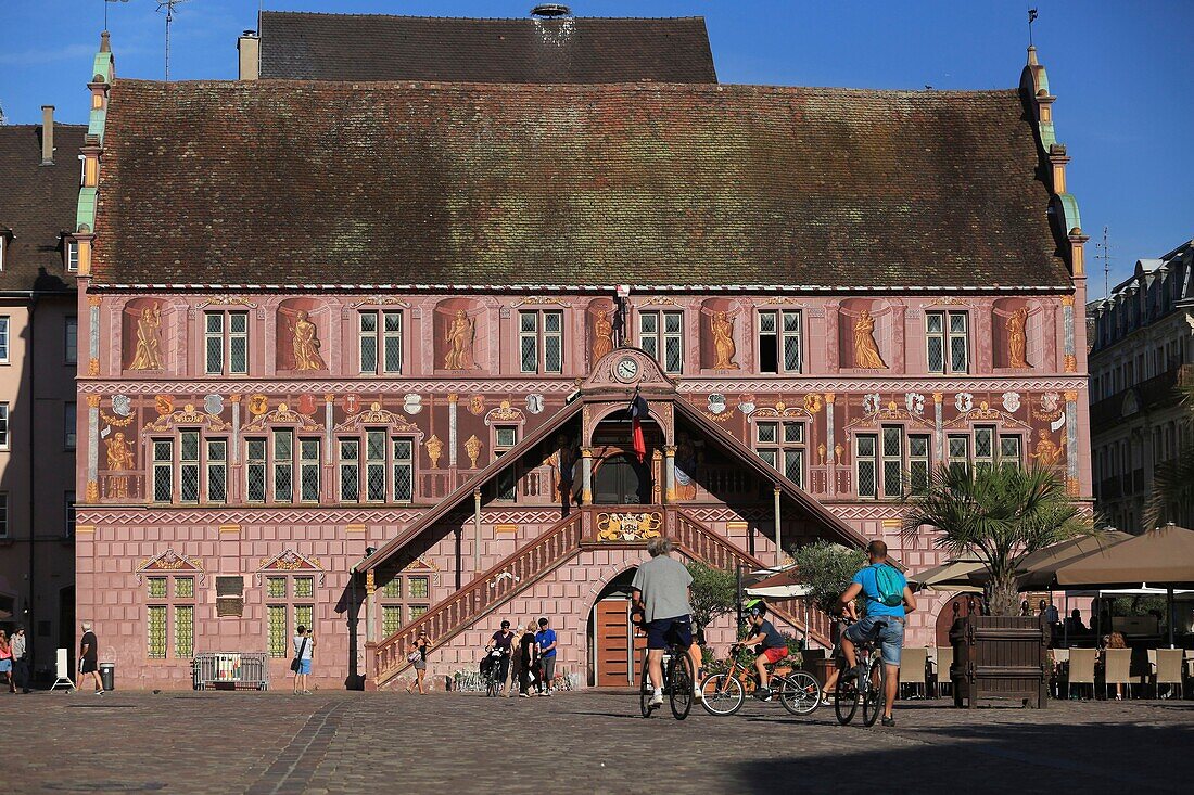 France,Haut Rhin,Mulhouse,Place de la Reunion,Cyclists on the Place de la Reunion in front of the hotel's facade