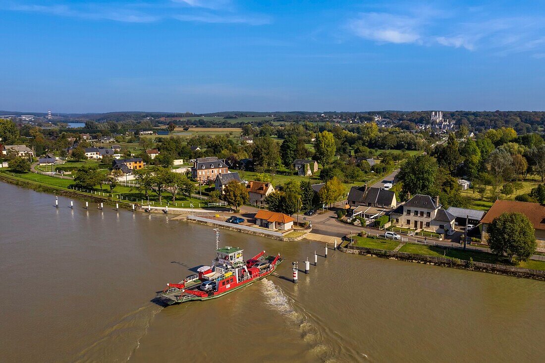 France,Seine-Maritime,Pays de Caux,Norman Seine River Meanders Regional Nature Park,the ferry crossing the Seine at Jumieges which abbey is in the background