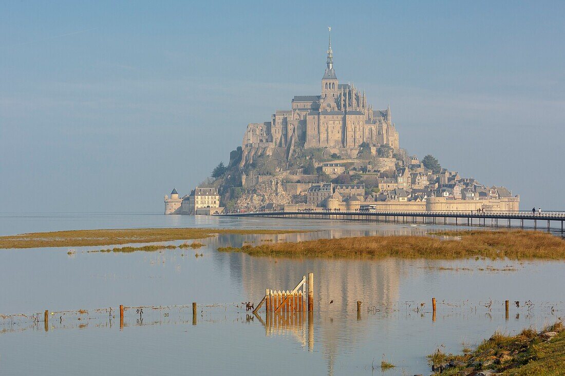 France,Manche,Mont Saint Michel bay listed as World Heritage by UNESCO,Mont Saint Michel at high tide and footbridge by architect Dietmar Feichtinger