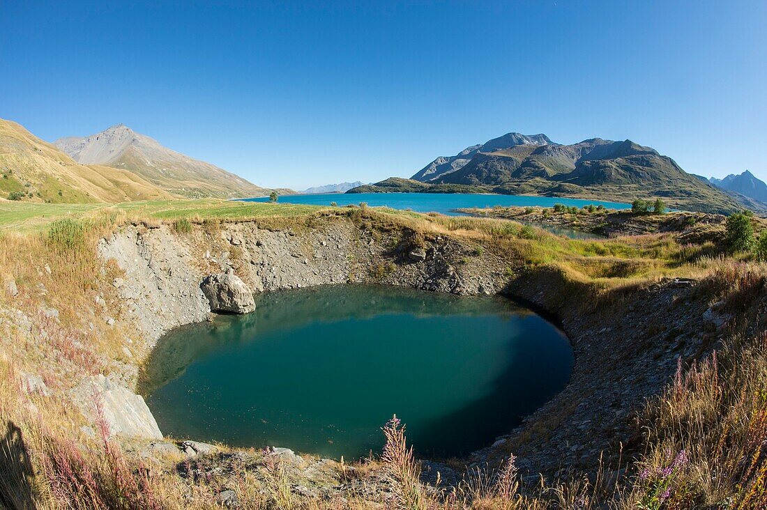 France,Savoie,Haute Maurienne,Val Cenis,Mont Cenis Pass,dam lake and concretions of gypsum,a funnel of dissolution created a small lake