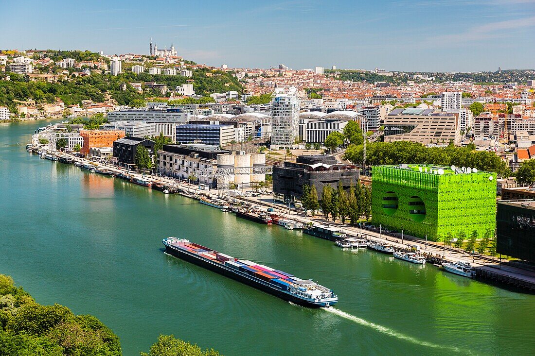 France,Rhône (69),Lyon,district of La Confluence in the south of the peninsula,first French quarter certified sustainable by the WWF,view of the quai Rambaud along the old docks with the Green Cube and Orange Cube and Notre Dame de Fourviere Basilica