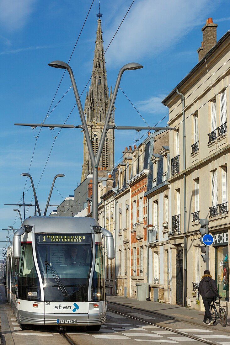 France,Meurthe et Moselle,Nancy,tramway on General Leclerc avenue and Notre Dame de Lourdes basilica in the background