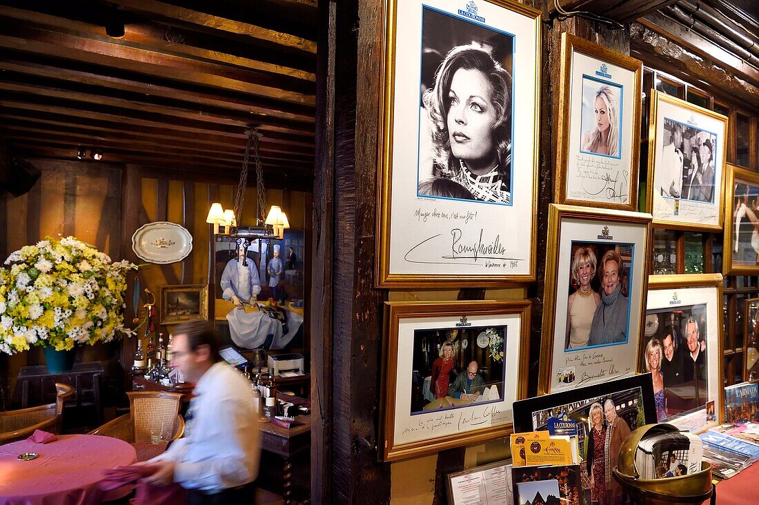 France,Seine Maritime,Rouen,place du Vieux Marché,the restaurant La Couronne in a half-timbered house from 1345 is the said to be the oldest inn in France,portrait of famous customers hanging on the walls