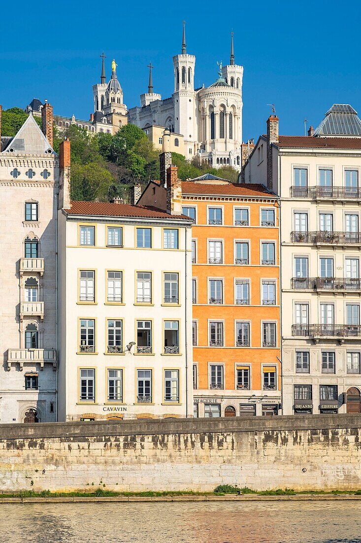 France,Rhone,Lyon,historic district listed as a UNESCO World Heritage site,Old Lyon,Quai Fulchiron on the banks of the Saone river,Notre-Dame de Fourviere basilica in the background