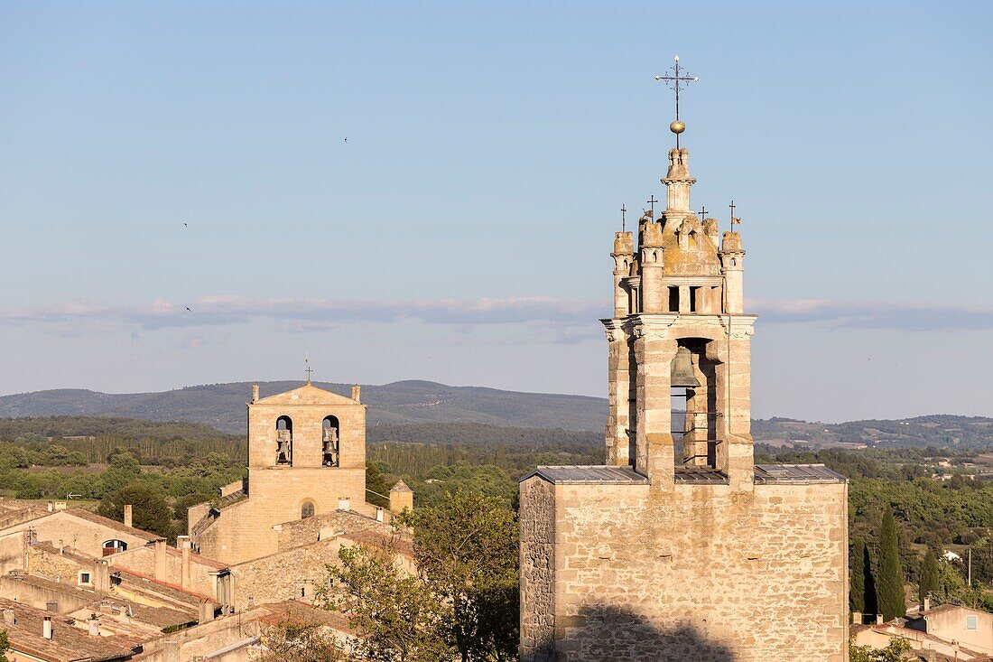 France,Vaucluse,Regional Natural Park of Luberon,Cucuron,the Clock Tower or Belfry in the foreground and at the bottom of the Notre Dame de Beaulieu church