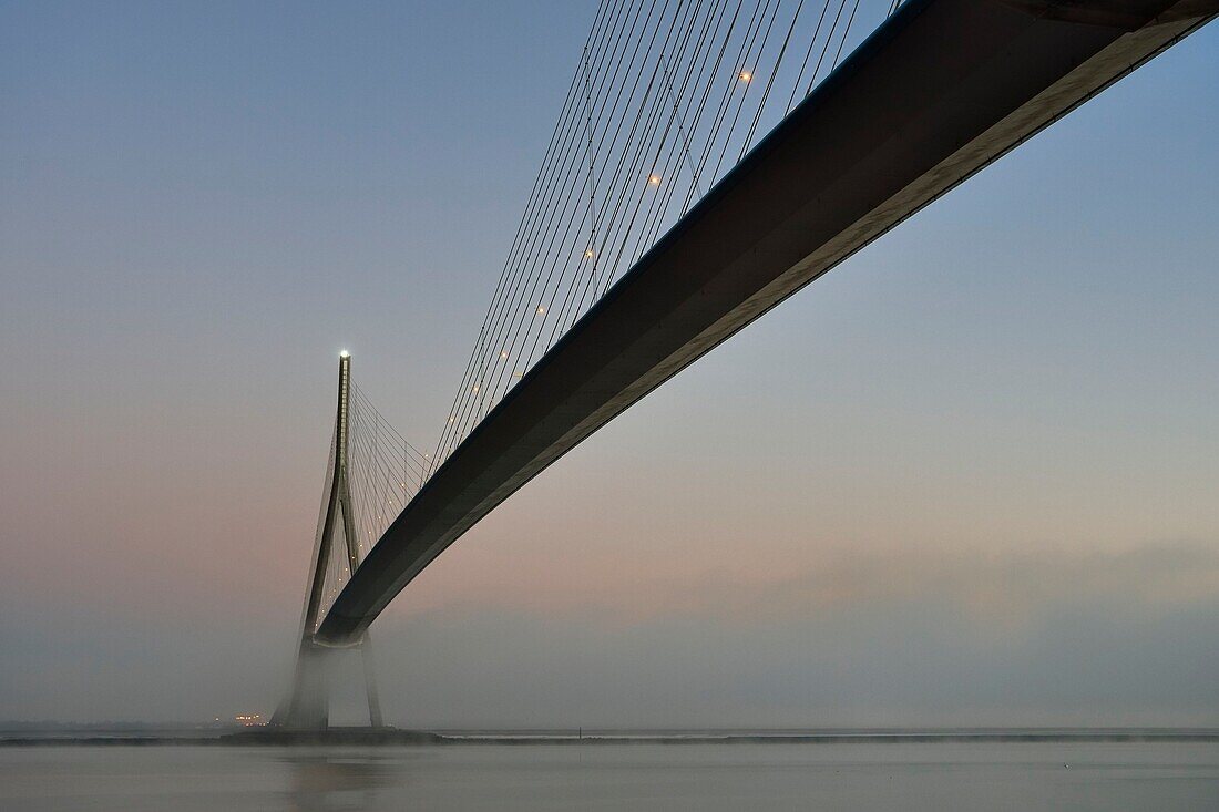 France,between Calvados and Seine Maritime,the Pont de Normandie (Normandy Bridge) in the mists of dawn,the deck is prestressed concrete except for its central part which is metallic