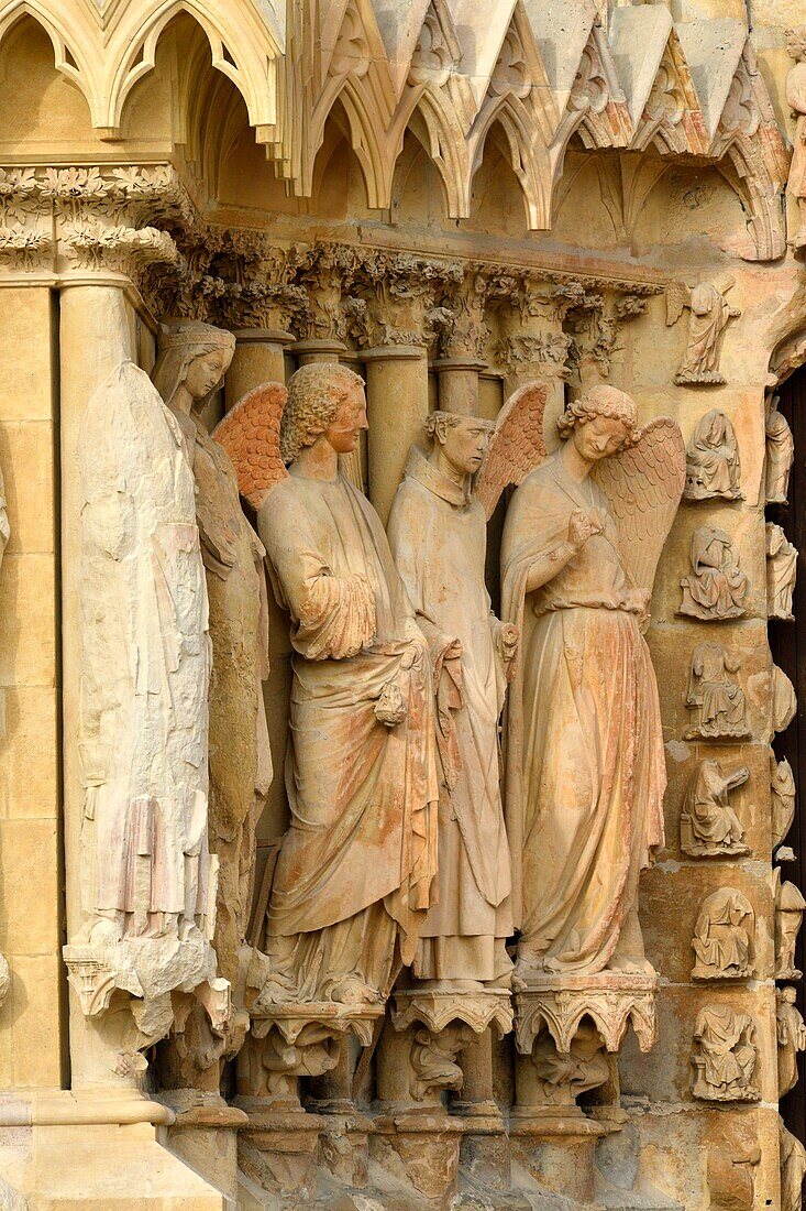 France,Marne,Reims,Notre Dame cathedral,listed as World Heritage by UNESCO,sculpture representing the angel with the smile on the left portal of the western frontage