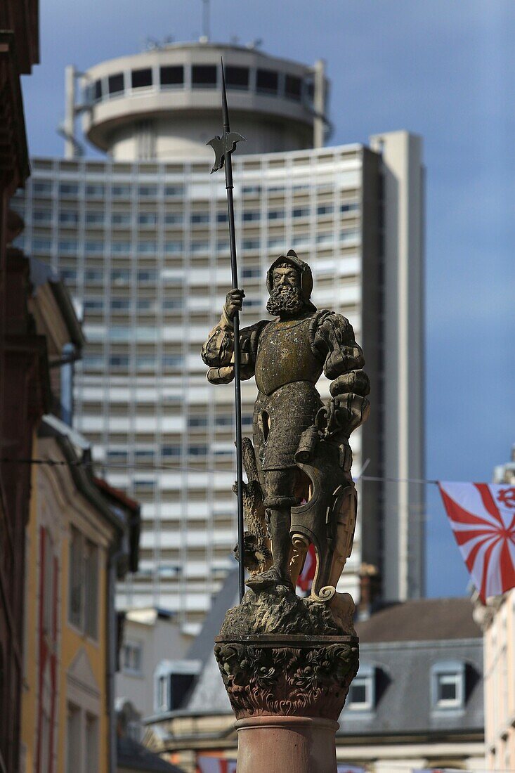 France,Haut Rhin,Mulhouse,at the intersection of Place de la Reunion and Rue Mercière,The Hallebardier fountain and the tower of Europe in the background