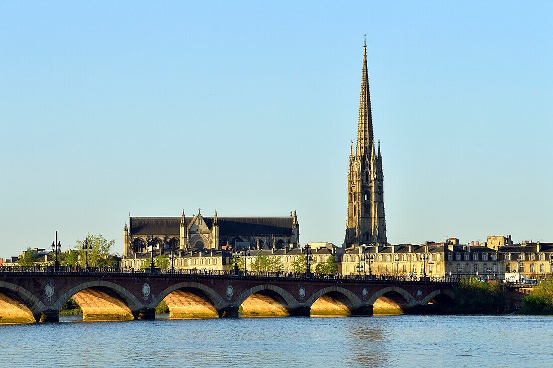 France,Gironde,Bordeaux,area listed as World Heritage by UNESCO,Pont de Pierre on the Garonne River and Saint Michel Basilica built between the 14th and 16th century Gothic style and it's tower of 114 m high