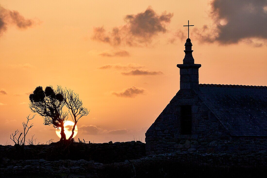 France,Finistere,Iroise Sea,Iles du Ponant,Parc Naturel Regional d'Armorique (Armorica Regional Natural Park),Ile de Sein,labelled Les Plus Beaux de France (The Most Beautiful Village of France),the Saint Corentin Chapel at sunset