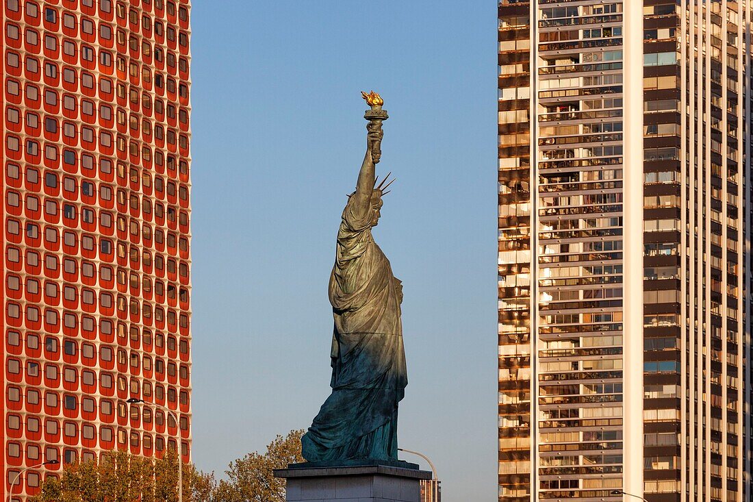 France,Paris,the banks of the Seine,the buildings of the Beaugrenelle district,the island of the swans with the Statue of Liberty